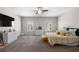 Bright carpeted main bedroom features a modern ceiling fan, natural light, and neutral walls at 224 Eva Way, Cartersville, GA 30121