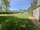 The large backyard showcases the detached two car garage and white house at 534 534 Shannon Way, Lawrenceville, GA 30044