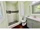 Modern bathroom featuring stylish tile shower and vanity with modern fixtures at 534 534 Shannon Way, Lawrenceville, GA 30044