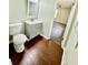 Charming bathroom with vanity, toilet, and view into a bedroom with gray carpets at 534 534 Shannon Way, Lawrenceville, GA 30044