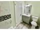 Bathroom featuring a stylish vanity, modern fixtures, and a gray wood-look floor at 534 534 Shannon Way, Lawrenceville, GA 30044