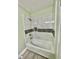 Updated bathroom with modern tiling and bathtub at 534 534 Shannon Way, Lawrenceville, GA 30044