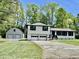 Charming home featuring an attached two-car garage and detached garage at 534 534 Shannon Way, Lawrenceville, GA 30044