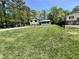 Expansive front yard with green grass and a view of the house and detached garage at 534 534 Shannon Way, Lawrenceville, GA 30044