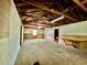 Unfinished interior of detached garage featuring plywood walls, concrete floor, and exposed beam ceiling at 534 534 Shannon Way, Lawrenceville, GA 30044