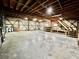 Spacious two car garage interior with concrete floors, wooden beams, and built-in storage at 534 534 Shannon Way, Lawrenceville, GA 30044
