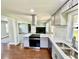 Modern kitchen featuring stainless steel appliances, gray cabinetry and tiled backsplash at 534 534 Shannon Way, Lawrenceville, GA 30044