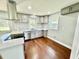 Modern kitchen featuring stainless steel appliances, gray cabinetry and tiled backsplash at 534 534 Shannon Way, Lawrenceville, GA 30044