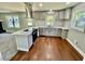 Modern kitchen featuring stainless steel appliances, gray cabinetry and tiled backsplash at 534 534 Shannon Way, Lawrenceville, GA 30044
