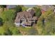 Aerial view of a private backyard with large deck at 560 Brook Manor Dr, Johns Creek, GA 30022