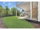 Spacious backyard with an outdoor patio, staircase, and lawn, perfect for entertaining at 560 Brook Manor Dr, Johns Creek, GA 30022
