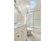Bathroom featuring skylight, tile floors, and shower-tub combo at 560 Brook Manor Dr, Johns Creek, GA 30022