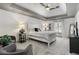 Bedroom features tray ceiling, carpeted floors, and a sitting area at 560 Brook Manor Dr, Johns Creek, GA 30022