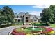 Community clubhouse with a water fountain, and meticulously kept landscaping at 560 Brook Manor Dr, Johns Creek, GA 30022