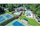 Aerial image of a tennis court, swimming pool, and playground at 560 Brook Manor Dr, Johns Creek, GA 30022