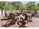 Outdoor deck features a cozy seating area with fire pit perfect for entertaining at 560 Brook Manor Dr, Johns Creek, GA 30022