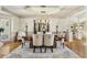 Elegant dining room with sophisticated lighting and neutral tones, creating a serene and inviting atmosphere at 560 Brook Manor Dr, Johns Creek, GA 30022