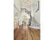 Bright, two-story foyer with a curved staircase and chandelier, showcasing an elegant entrance to the home at 560 Brook Manor Dr, Johns Creek, GA 30022