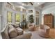 Inviting living room featuring large windows, hardwood floors, and comfortable seating at 560 Brook Manor Dr, Johns Creek, GA 30022