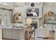 Relaxing living room features a fireplace, soft lighting, built-in shelving, and comfortable couches and chairs at 560 Brook Manor Dr, Johns Creek, GA 30022