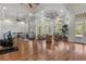 Spacious recreation room with wood floors, weights, exercise equipment, and living room area at 560 Brook Manor Dr, Johns Creek, GA 30022