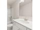 Bathroom showcasing a white vanity with sink and a shower with white tile at 7162 Linden Dr, South Fulton, GA 30349