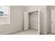 An empty bedroom with an open closet and carpet flooring at 7162 Linden Dr, South Fulton, GA 30349
