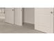 Carpeted hallway with open door to walk-in closet at 7162 Linden Dr, South Fulton, GA 30349