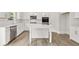 Modern kitchen showcasing white cabinetry, stainless appliances, and a center island at 7162 Linden Dr, South Fulton, GA 30349