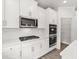 Beautiful kitchen with white cabinetry, stainless steel appliances, and a spacious pantry at 7162 Linden Dr, South Fulton, GA 30349
