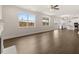 Bright open-concept living area with hardwood floors, large windows, and a fireplace at 7162 Linden Dr, South Fulton, GA 30349