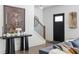 Inviting entryway featuring a modern table, staircase, artwork, and stylish front door at 1984 Yellow Finch Se Trl, Atlanta, GA 30316