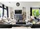 Bright living room features a fireplace, stylish decor, and large windows at 1984 Yellow Finch Se Trl, Atlanta, GA 30316