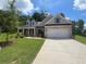 Charming single-Gathering home with a two-car garage, landscaped lawn, and classic architectural details at 350 Brooke View Trl, Canton, GA 30115