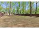 Expansive lawn featuring a wooden privacy fence and several mature trees at 3915 Ivy Ne Rd, Atlanta, GA 30342