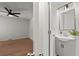 Bathroom featuring a gray vanity, modern mirror, and view into the light-filled bedroom at 3915 Ivy Ne Rd, Atlanta, GA 30342