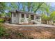 Charming brick home featuring a landscaped front yard, updated windows and inviting entryway steps at 3915 Ivy Ne Rd, Atlanta, GA 30342