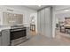 The kitchen features modern stainless steel appliances, gray cabinets, and seamless flow into adjacent rooms at 3915 Ivy Ne Rd, Atlanta, GA 30342