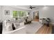 Spacious living room featuring neutral paint, hardwood flooring and a seamless open floorplan at 3915 Ivy Ne Rd, Atlanta, GA 30342