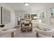 Inviting home office offers natural light, hardwood floors, and modern decor creating a serene workspace at 3915 Ivy Ne Rd, Atlanta, GA 30342