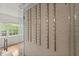 This wine cellar features custom racks and a patterned tile wall, offering a sleek, temperature-controlled storage solution at 3915 Ivy Ne Rd, Atlanta, GA 30342