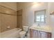 Bathroom featuring shower with tile, vanity, and mirror at 683 Pryor Sw St # C, Atlanta, GA 30315