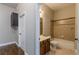 Neutral toned bathroom with tub shower combo, vanity, and wood look flooring at 683 Pryor Sw St # C, Atlanta, GA 30315