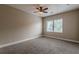 Bedroom featuring large window, carpeted floors and ceiling fan at 683 Pryor Sw St # C, Atlanta, GA 30315
