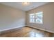 Bedroom featuring hardwood floors, window, and neutral-colored walls at 683 Pryor Sw St # C, Atlanta, GA 30315