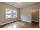 Bright bedroom features hardwood floors, neutral walls, and a window with natural light at 683 Pryor Sw St # C, Atlanta, GA 30315