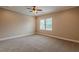 Spacious bedroom features neutral carpet, paint, and trim and a ceiling fan and window at 683 Pryor Sw St # C, Atlanta, GA 30315