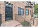 Brick stairs lead up to a wrought iron security door and entrance of townhome at 683 Pryor Sw St # C, Atlanta, GA 30315
