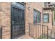 Brick stairs lead up to a wrought iron security door and entrance of townhome at 683 Pryor Sw St # C, Atlanta, GA 30315