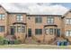 Brick townhomes showing front entrances with wrought iron security doors and stairs at 683 Pryor Sw St # C, Atlanta, GA 30315